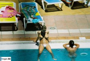 Girls sunbathe topless near the pool. Thumb 12