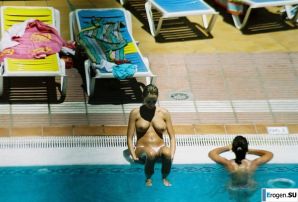 Girls sunbathe topless near the pool. Thumb 17