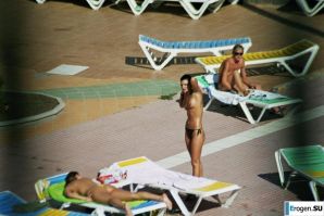 Girls sunbathe topless near the pool. Thumb 24