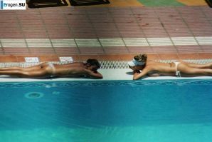Girls sunbathe topless near the pool. Thumb 26