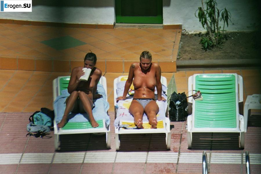 Girls sunbathe topless near the pool. Part 2. Photo 15