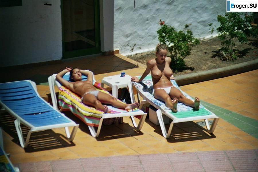 Girls sunbathe topless near the pool. Part 2. Photo 20