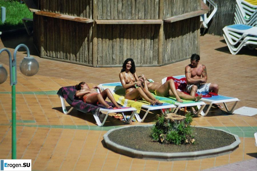 Girls sunbathe topless near the pool. Part 2. Photo 22