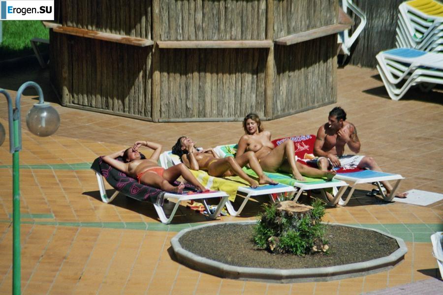Girls sunbathe topless near the pool. Part 2. Photo 23
