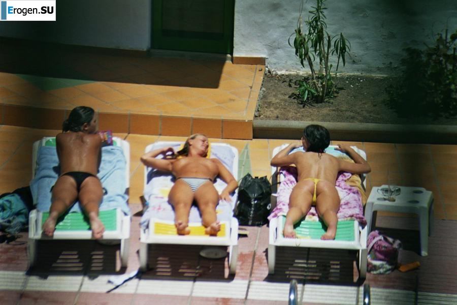 Girls sunbathe topless near the pool. Part 2. Photo 27