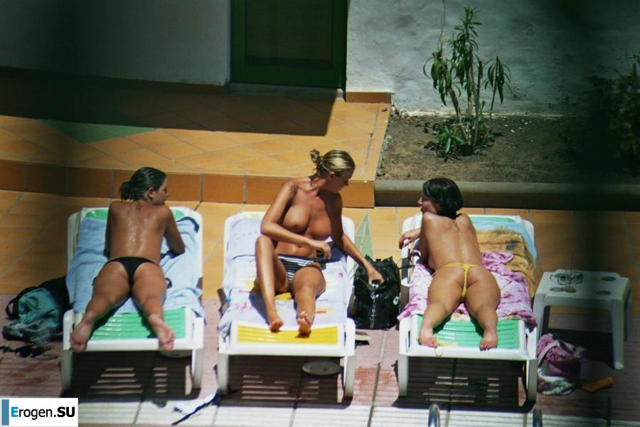 Girls sunbathe topless near the pool. Part 2. Photo 31