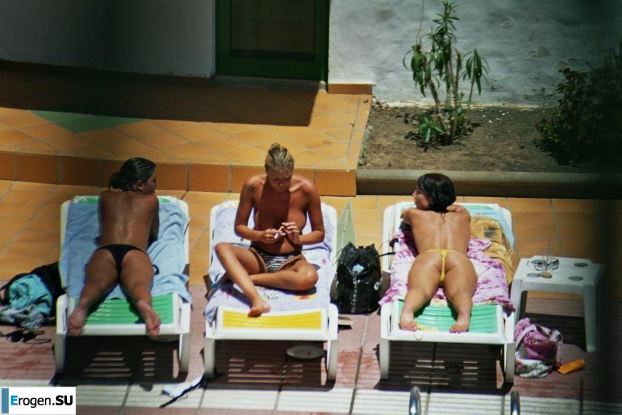 Girls sunbathe topless near the pool. Part 2. Photo 32