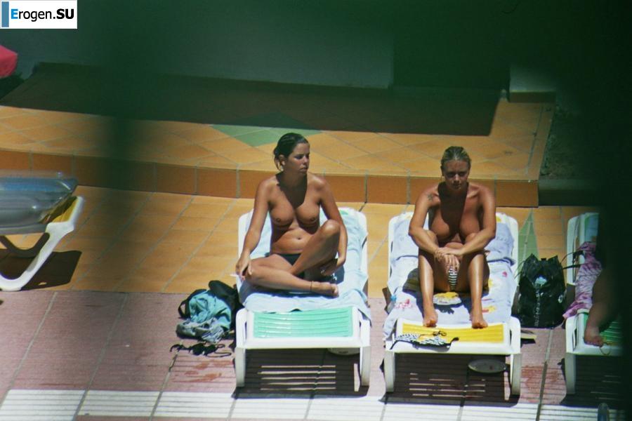 Girls sunbathe topless near the pool. Part 2. Photo 33