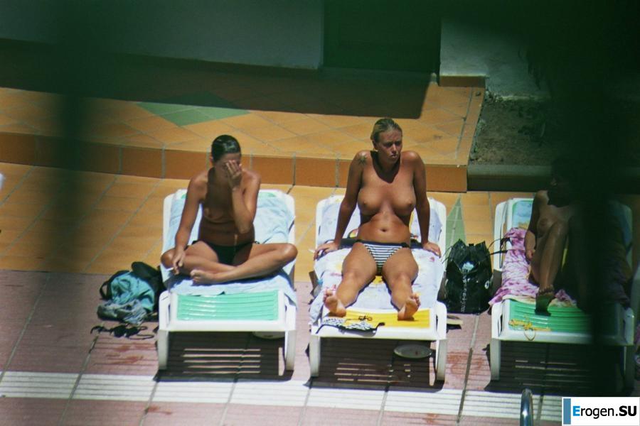Girls sunbathe topless near the pool. Part 2. Photo 34