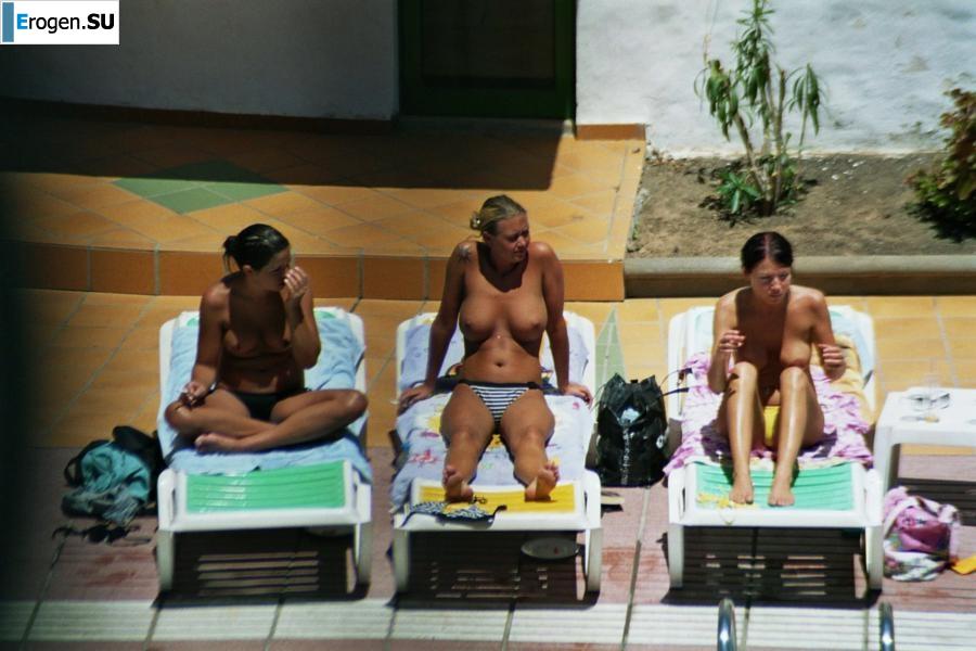 Girls sunbathe topless near the pool. Part 2. Photo 35