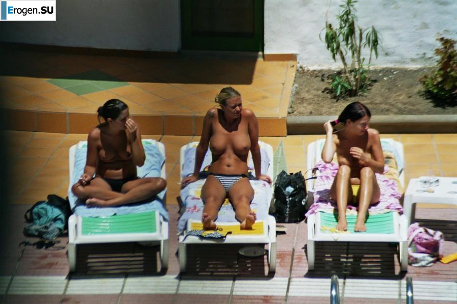 Girls sunbathe topless near the pool. Part 2. Photo 36