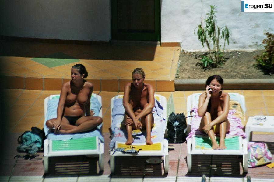 Girls sunbathe topless near the pool. Part 2. Photo 37