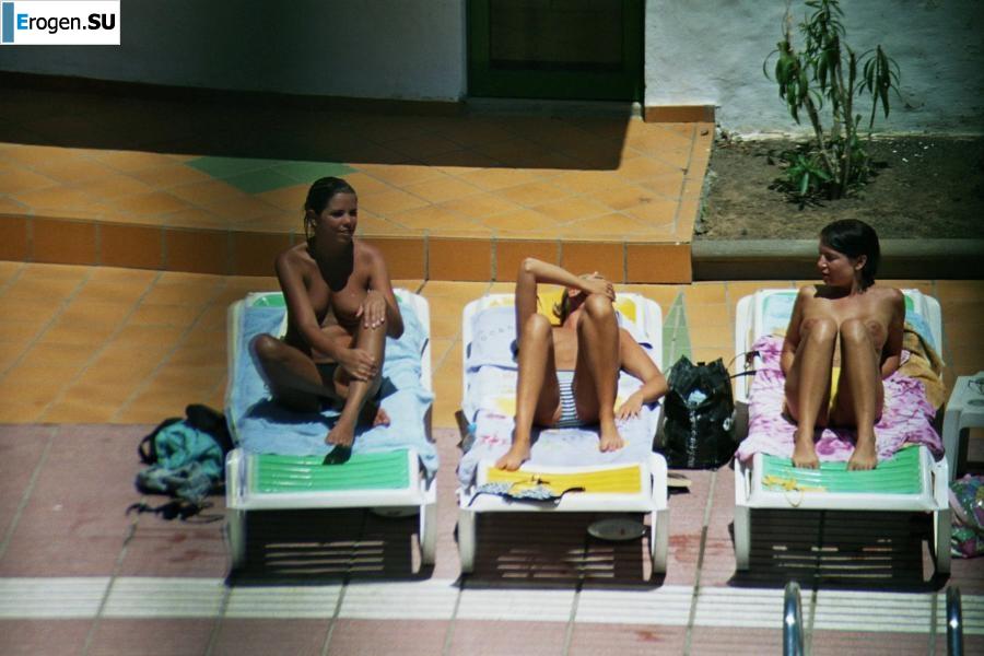 Girls sunbathe topless near the pool. Part 2. Photo 38