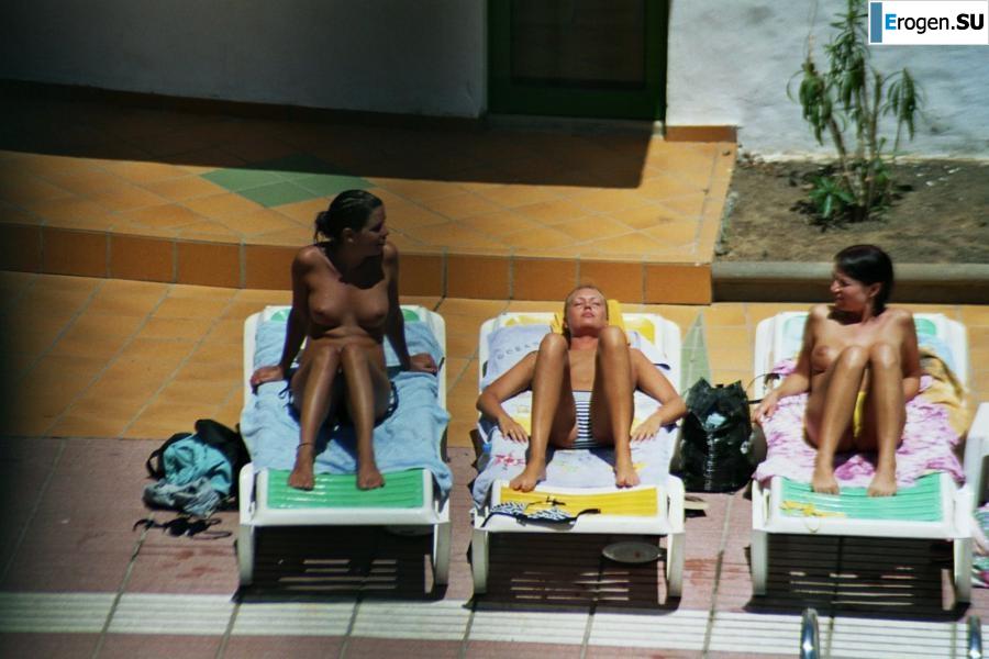 Girls sunbathe topless near the pool. Part 2. Photo 39