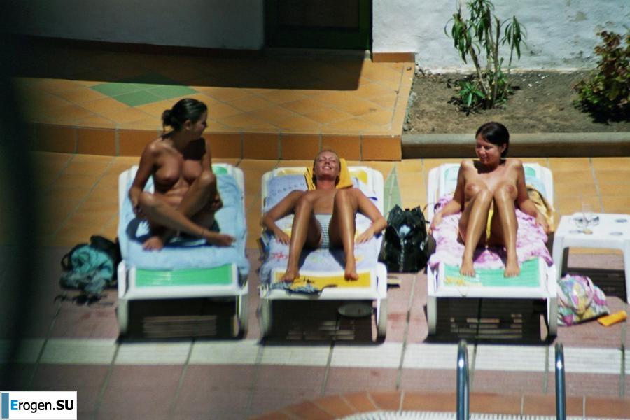 Girls sunbathe topless near the pool. Part 2. Photo 40