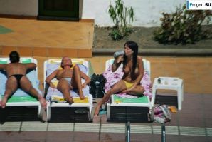 Girls sunbathe topless near the pool. Part 2. Thumb 5
