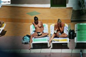 Girls sunbathe topless near the pool. Part 2. Thumb 8