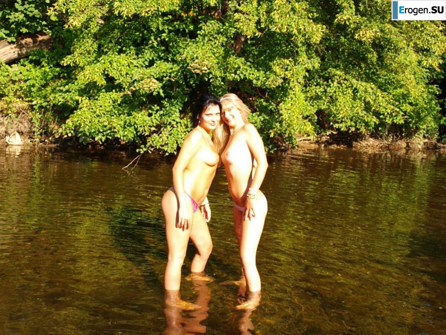 two girlfriends without bras by the river. Photo 24