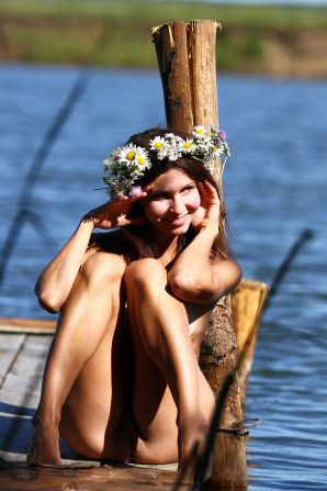 undressed outdoors in front of the photographer. Thumb 34