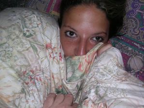 A tanned brunette shines her tits in the morning in bed. Thumb 11