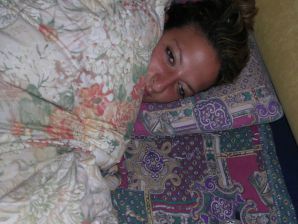 A tanned brunette shines her tits in the morning in bed. Thumb 13