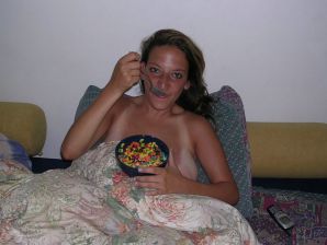 A tanned brunette shines her tits in the morning in bed. Thumb 14