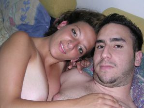 A tanned brunette shines her tits in the morning in bed. Thumb 19