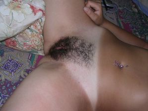 A tanned brunette shines her tits in the morning in bed. Thumb 25