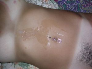 A tanned brunette shines her tits in the morning in bed. Thumb 30