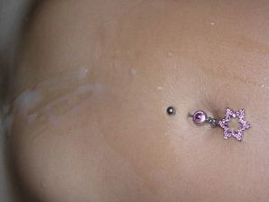 A tanned brunette shines her tits in the morning in bed. Thumb 31