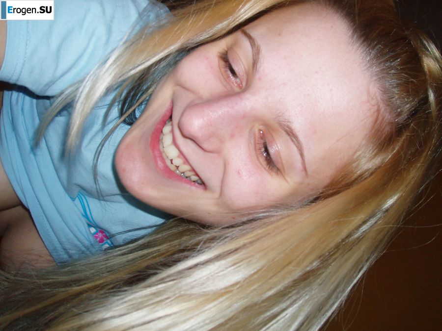 A charming girl undressed to her blouse and poses with cancer. Photo 10