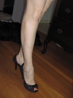 A mature woman posing in a transparent dress in front of a man. Thumb 28