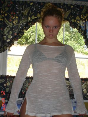 A blue-eyed minx with a pierced nipple plays with her panties. Thumb 17