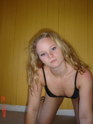 A blue-eyed minx with a pierced nipple plays with her panties. Thumb 28