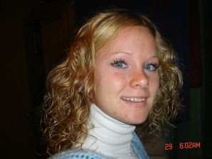 A blue-eyed minx with a pierced nipple plays with her panties. Thumb 39