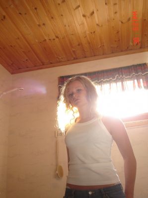 A blue-eyed minx with a pierced nipple plays with her panties. Thumb 9