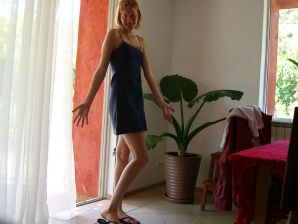 A tanned blonde with lingerie marks poses for a friend. Thumb 5