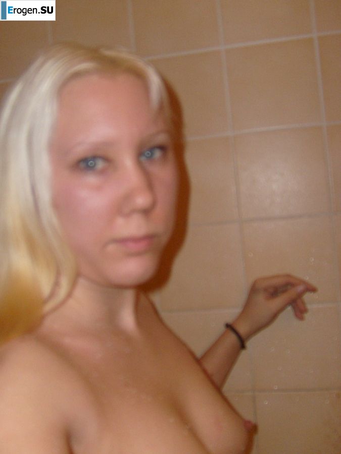 The blonde opened her labia and showed a wet vagina. Photo 5