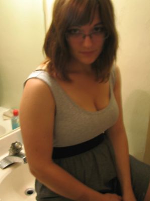 A girl with large breasts poses in clothes and then undresses. Part 2. Thumb 13