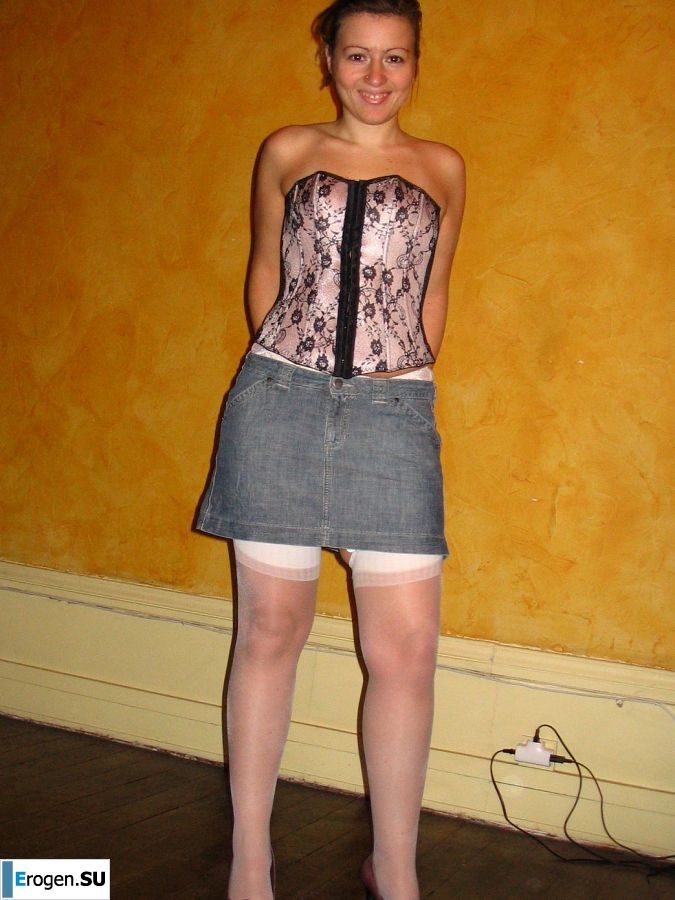 A young woman shows her ass and legs in white stockings. Photo 22