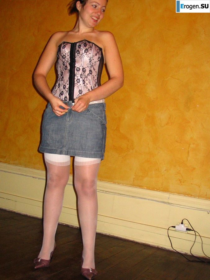 A young woman shows her ass and legs in white stockings. Photo 24