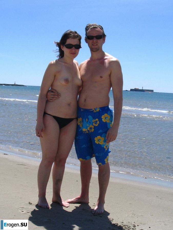 A young woman shows her ass and legs in white stockings. Photo 6