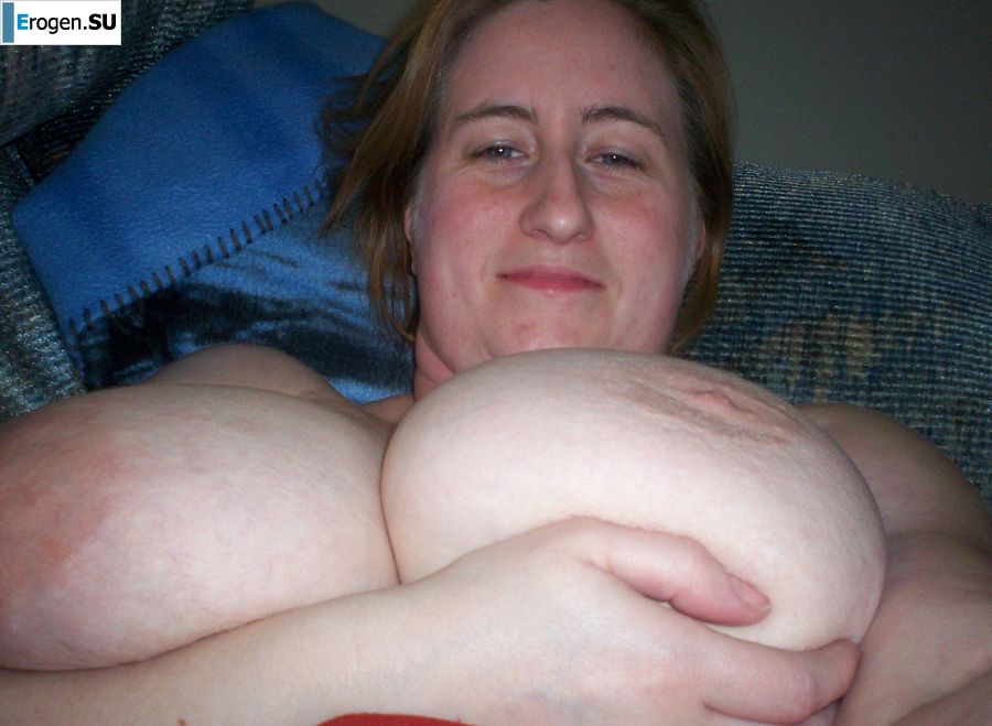 Busty woman posing in short dresses. Photo 16