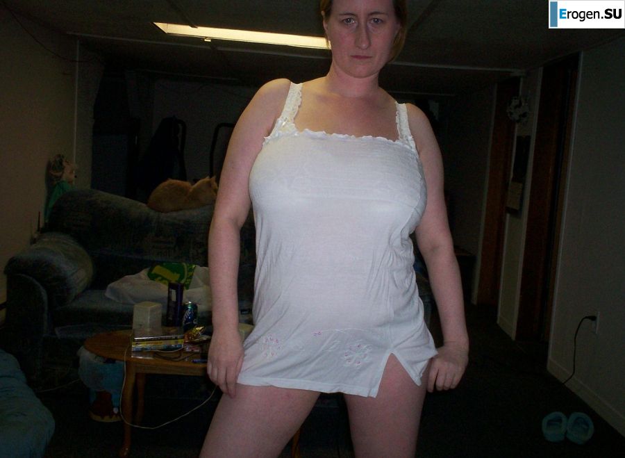 Busty woman posing in short dresses. Photo 17