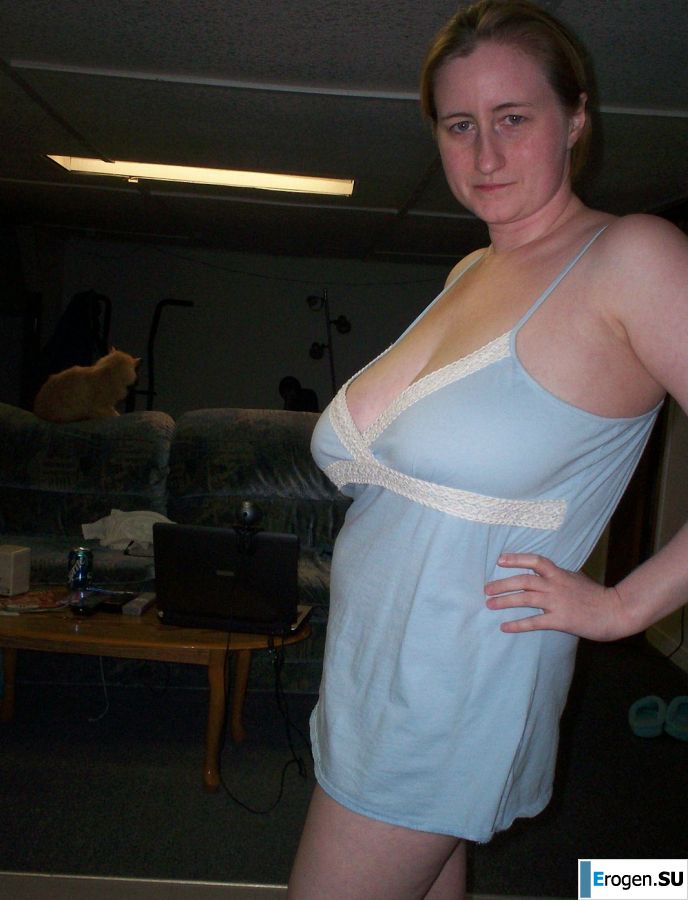 Busty woman posing in short dresses. Photo 23