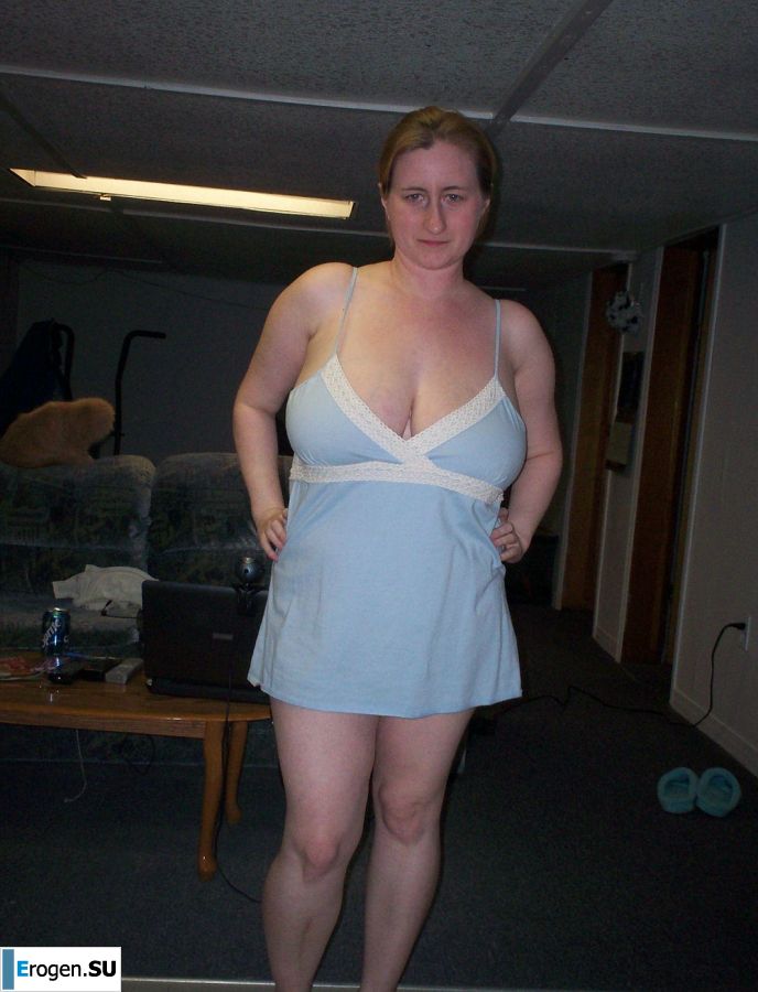 Busty woman posing in short dresses. Photo 24