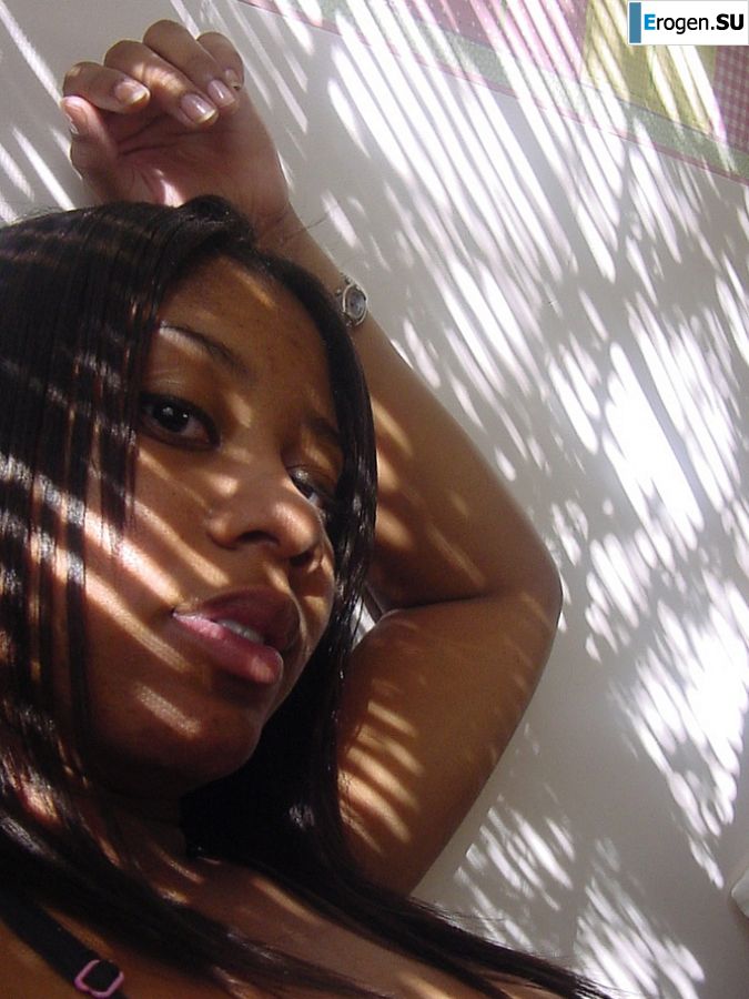 The mulatto pulls her boobs, and then spreads her legs. Photo 28