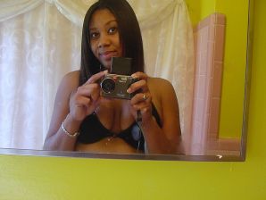 The mulatto pulls her boobs, and then spreads her legs. Thumb 22