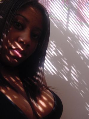 The mulatto pulls her boobs, and then spreads her legs. Thumb 25