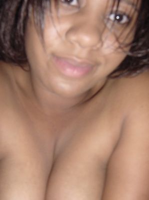 The mulatto pulls her boobs, and then spreads her legs. Thumb 29